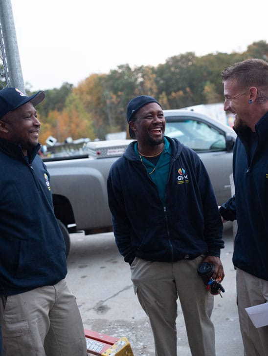 GEM Technicians Talking Outside