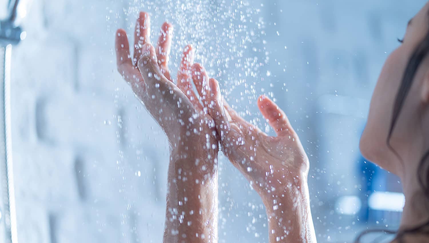 Hands under running water