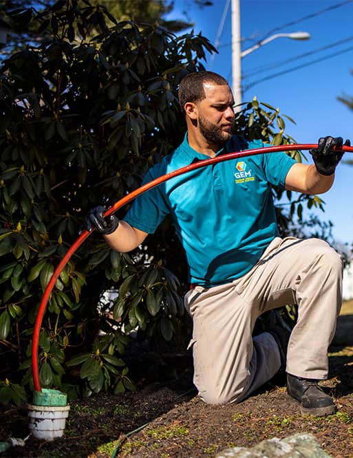 Technician cleaning main sewer line