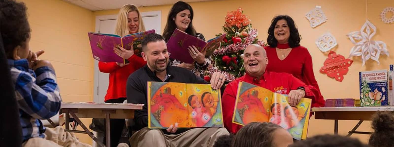 GEM team reading books to kids at McAuley House