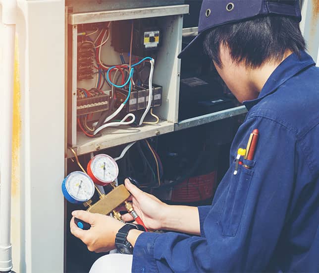 Technician working on a heating system