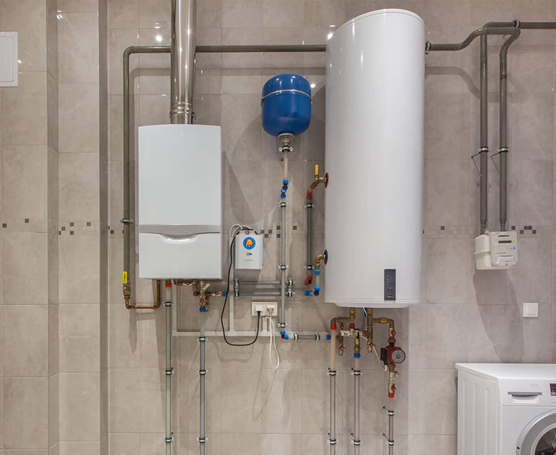 Boiler in nicely tiled utilities room