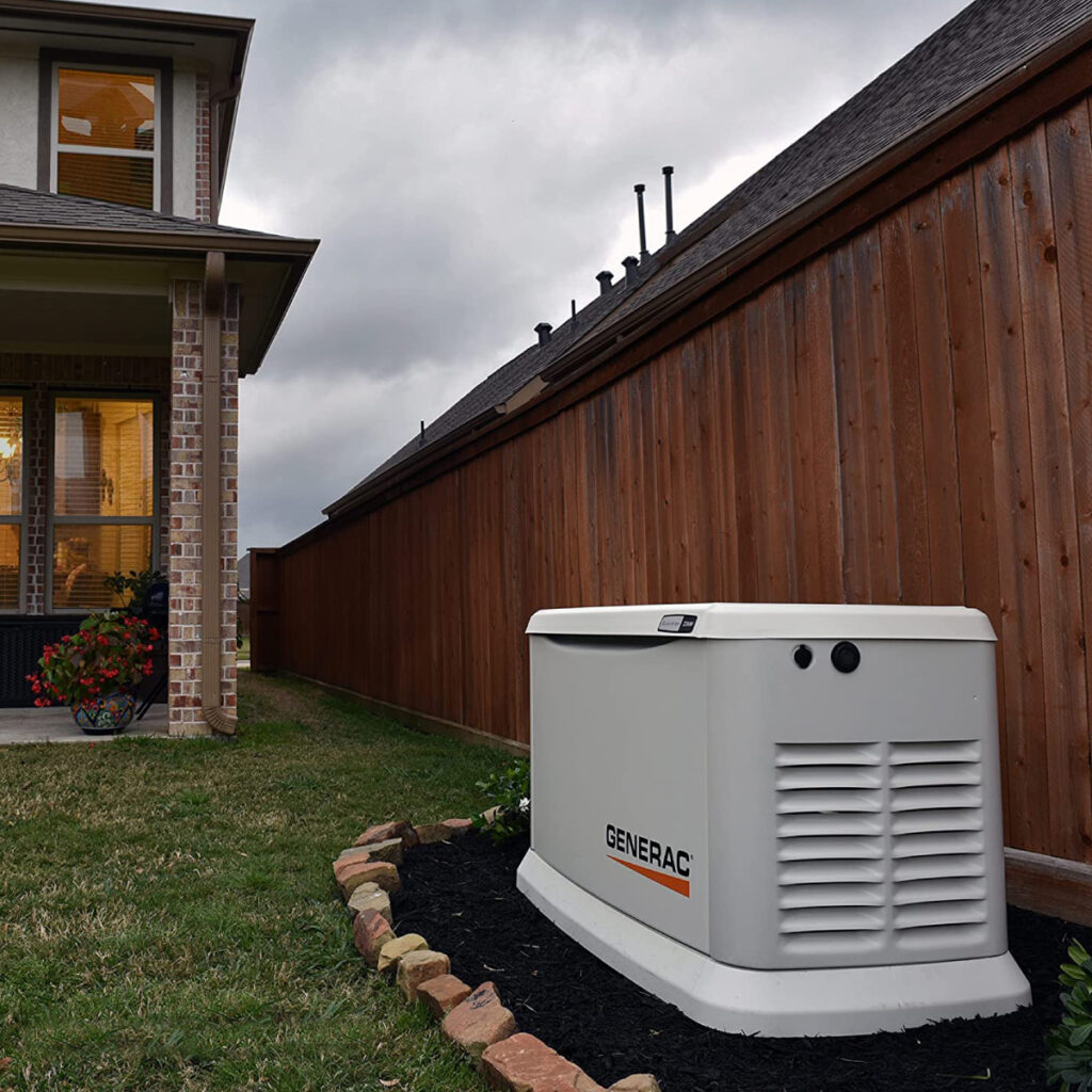 Residential generator installed beside home
