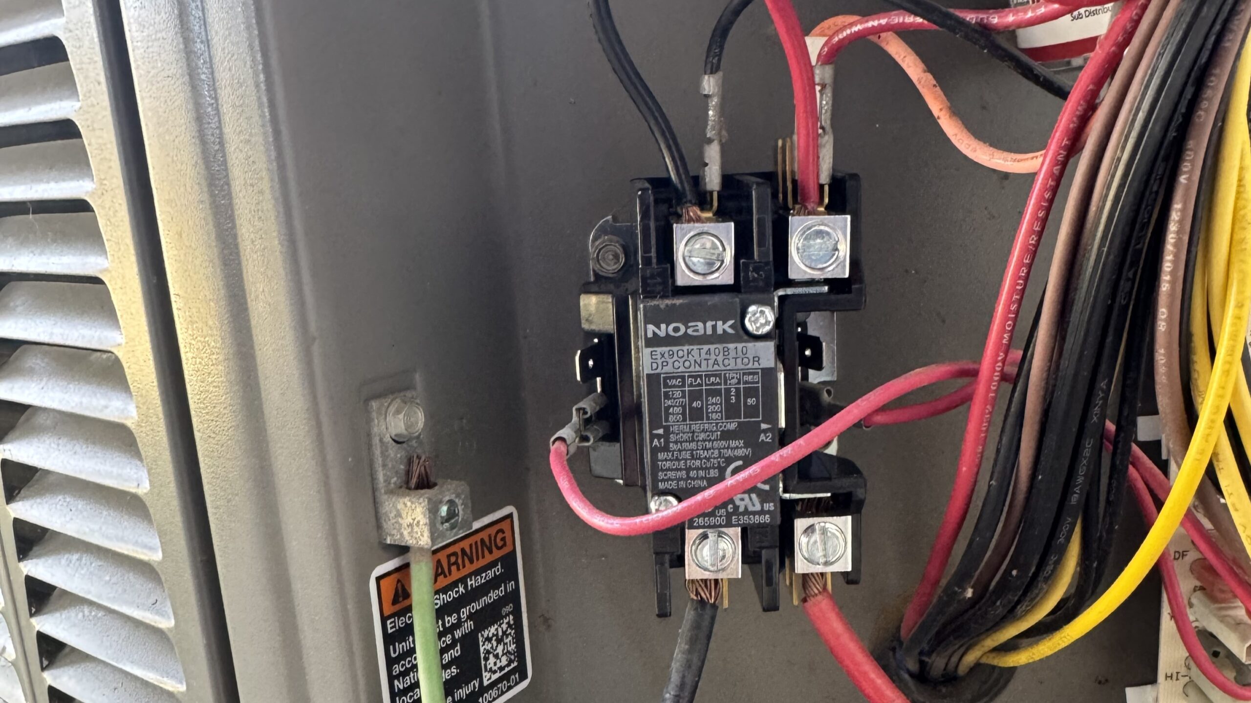 View of an AC contactor in an AC. A contactor issue could be why your AC keeps shutting off.