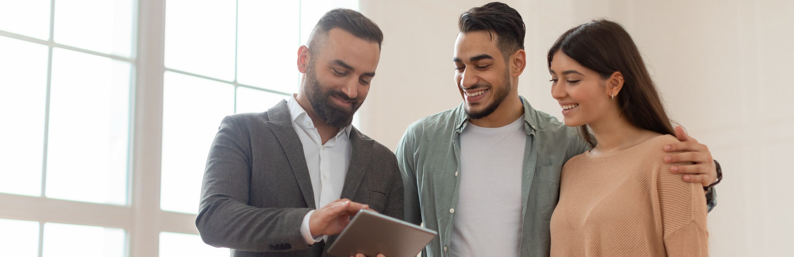 A couple talks with a home energy auditor