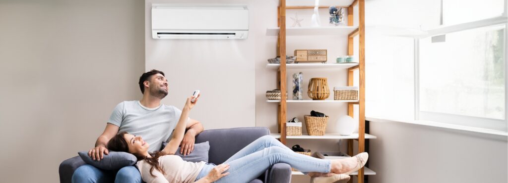 Family relaxing in living room after HVAC service to fix their ac not cooling