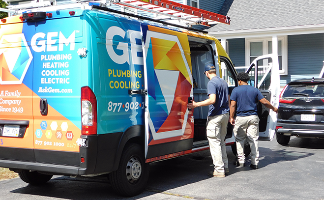 GEM service vehicles parked outside customer home