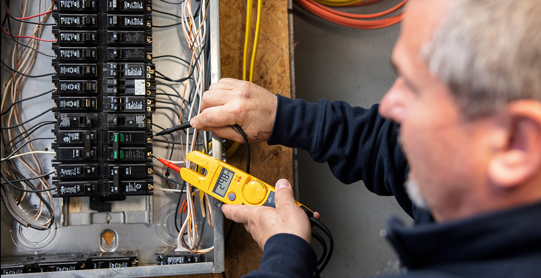 Licensed GEM electrician working on an electrical panel upgrade