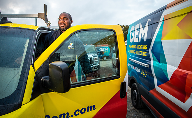 GEM technician entering service vehicle for home repair visit