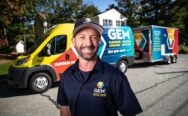GEM technician portrait in front of GEM service truck