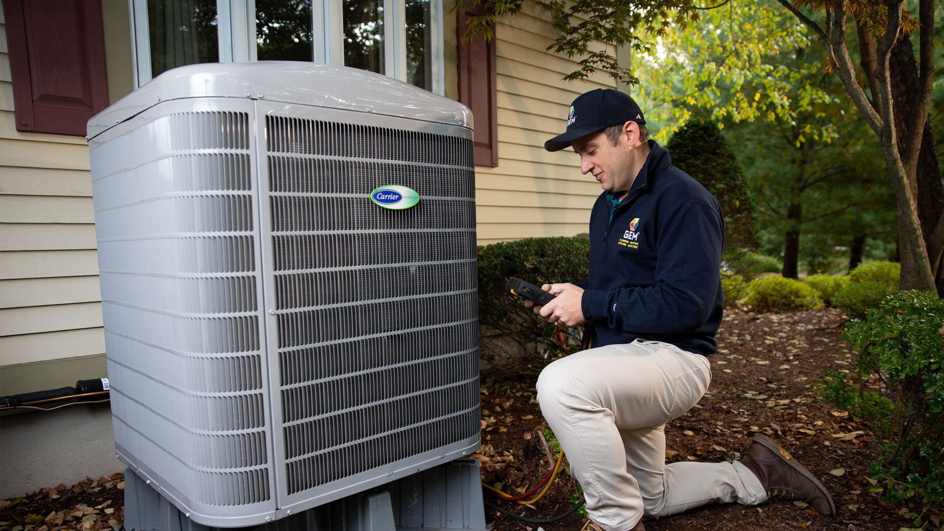 GEM Tech repairing HVAC outdoors