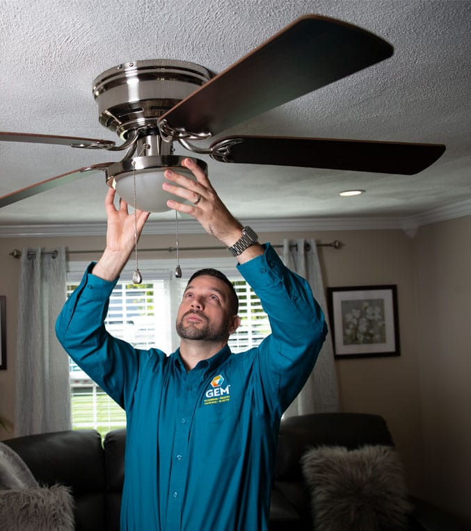 GEM Technician Repairing Ceiling Fan