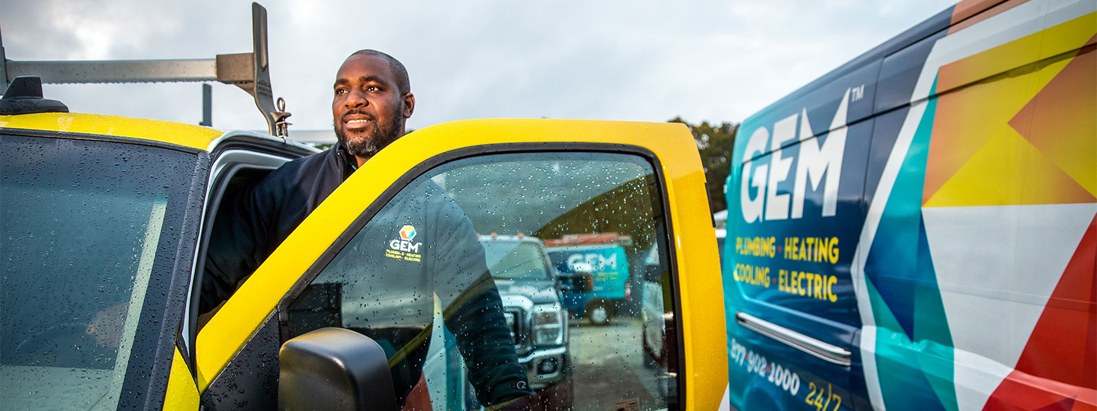 GEM employee entering a service truck
