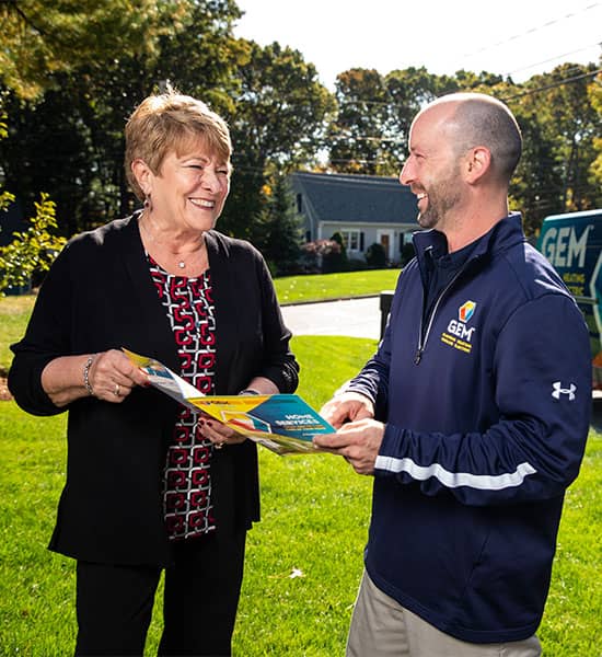 GEM technician talking to customer outside home