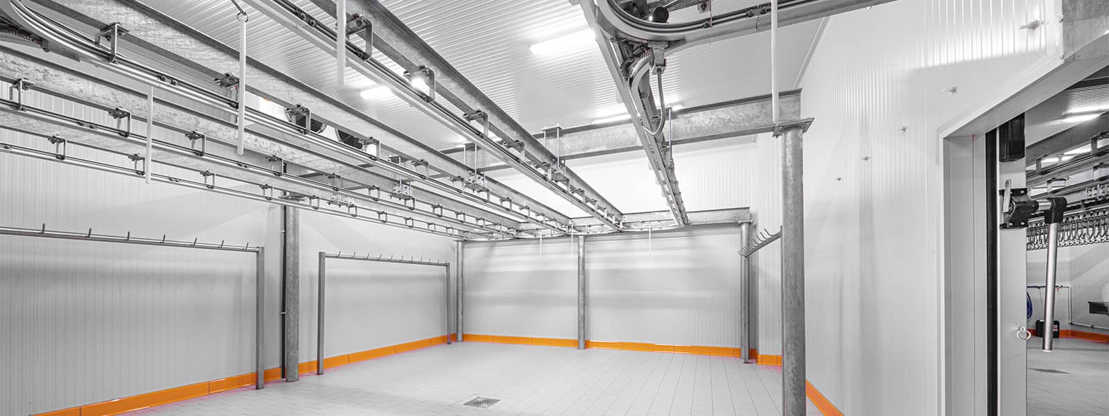 a large white, empty commercial refrigerator.