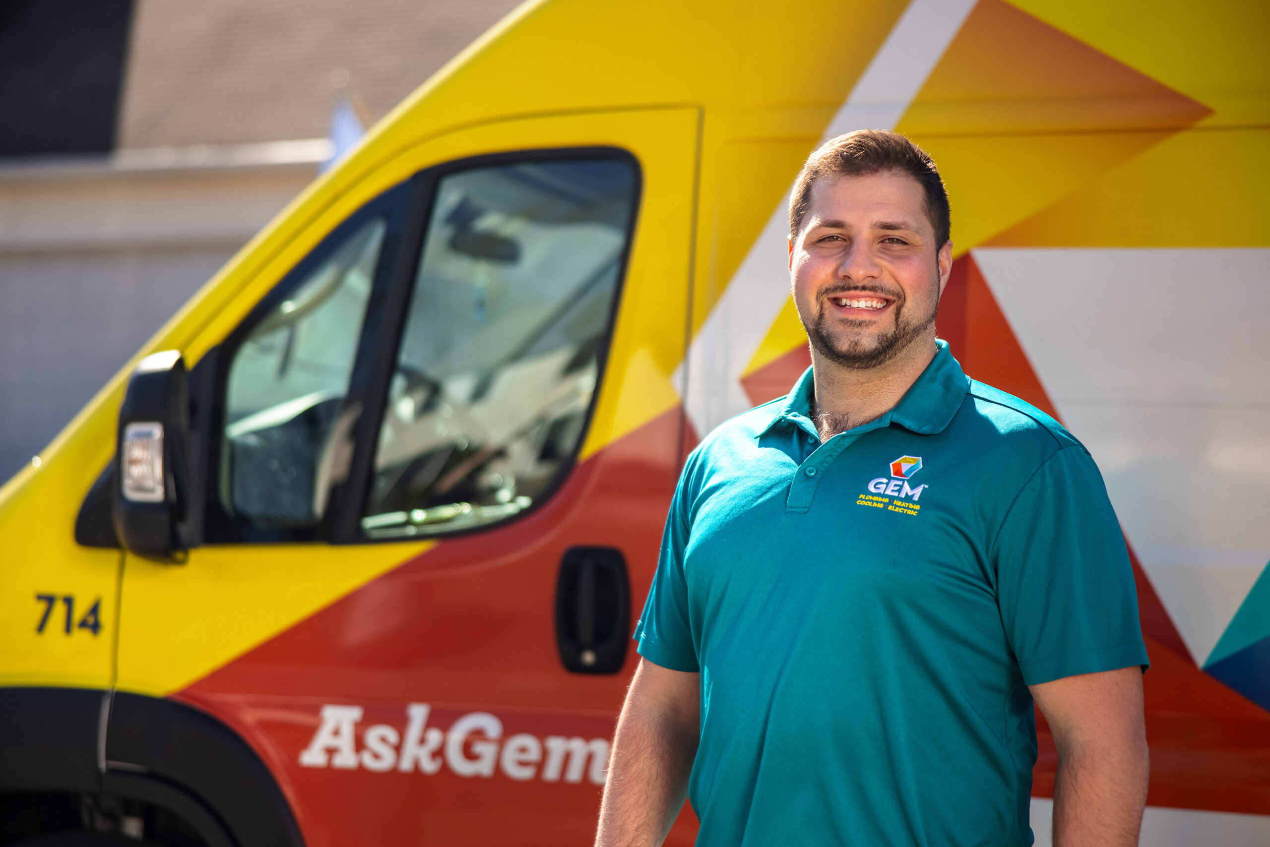 GEM plumber in front of a truck