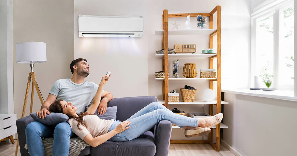 Couple enjoy cooling from new air conditioner
